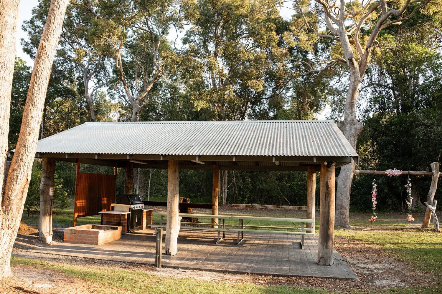 The shared BBQ gazebo beneath the gums